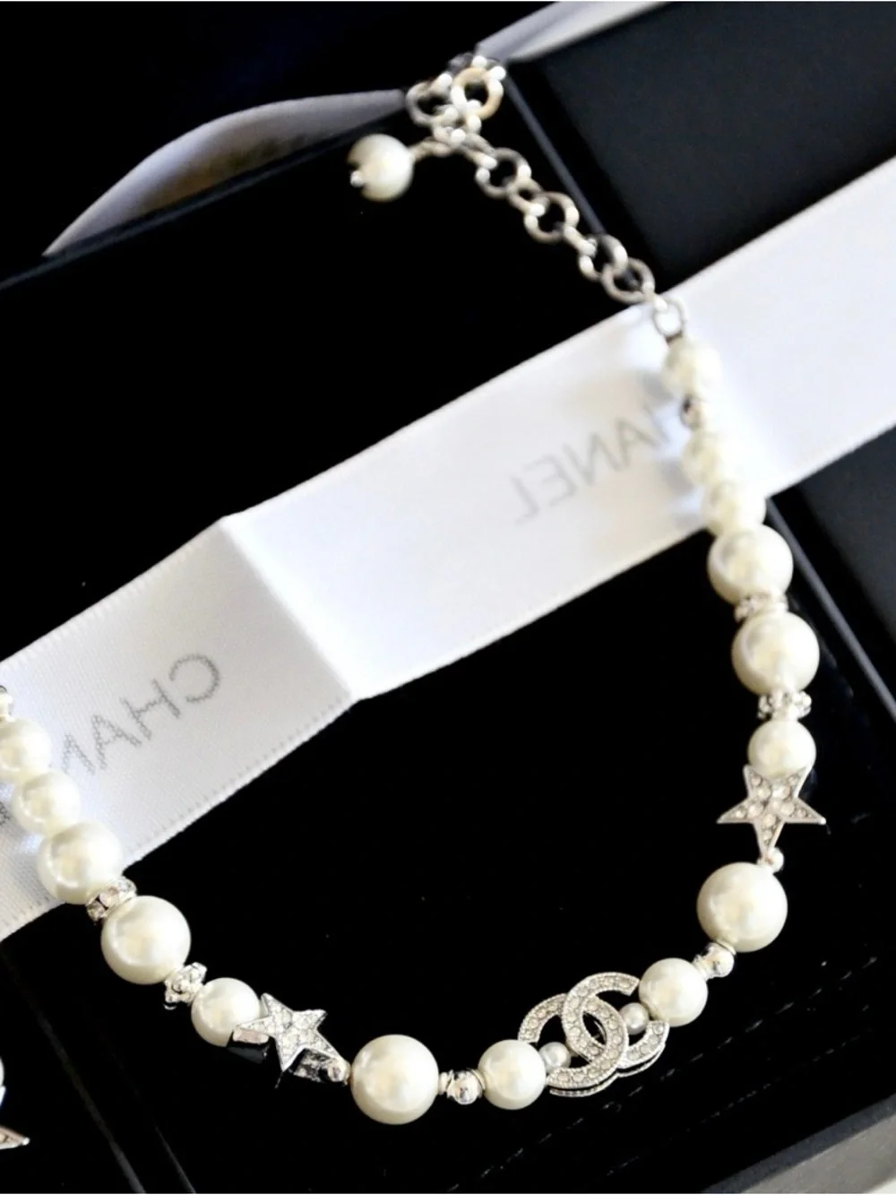 CHANEL Pearl Bracelet with Crystal CC Logo and Star Accents in White and Silver